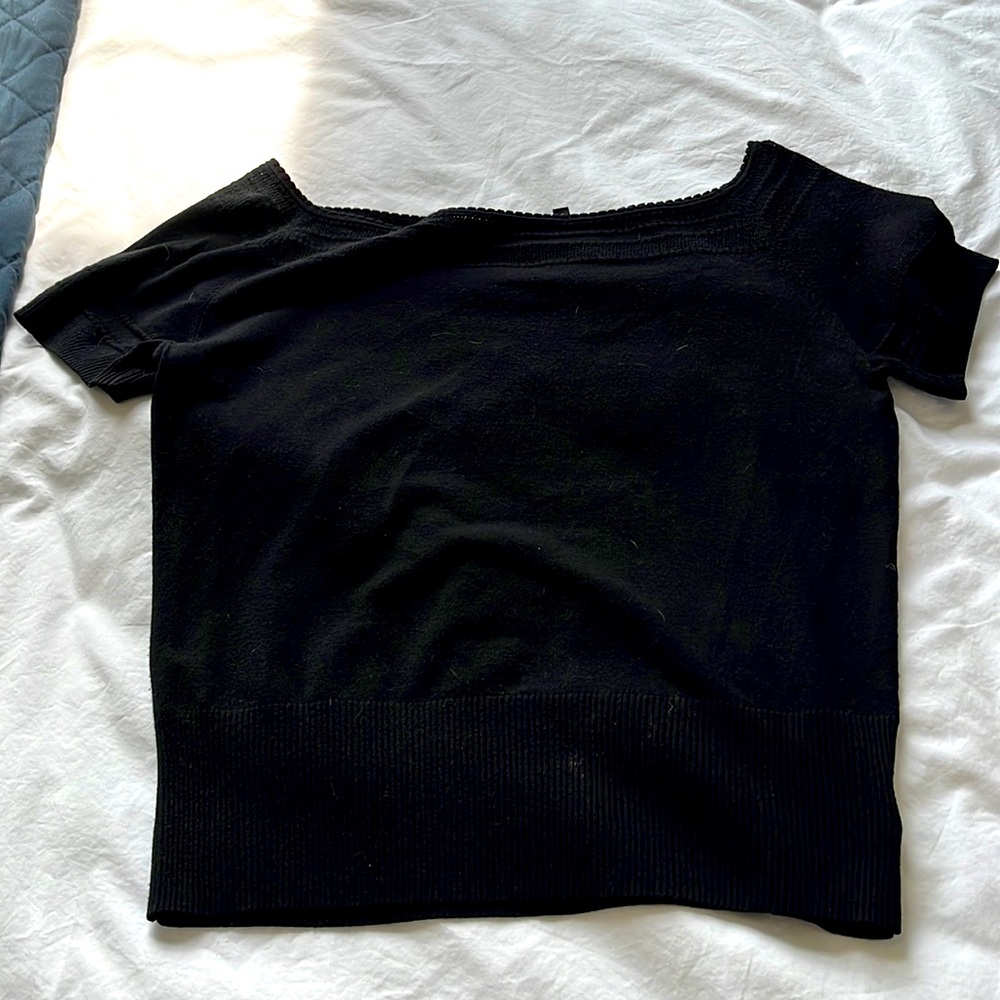 Size Large black short sleeve knit top.   Looks great alone or under a blazer